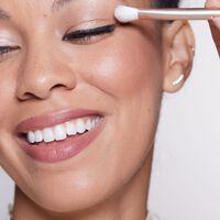 model with eye brush